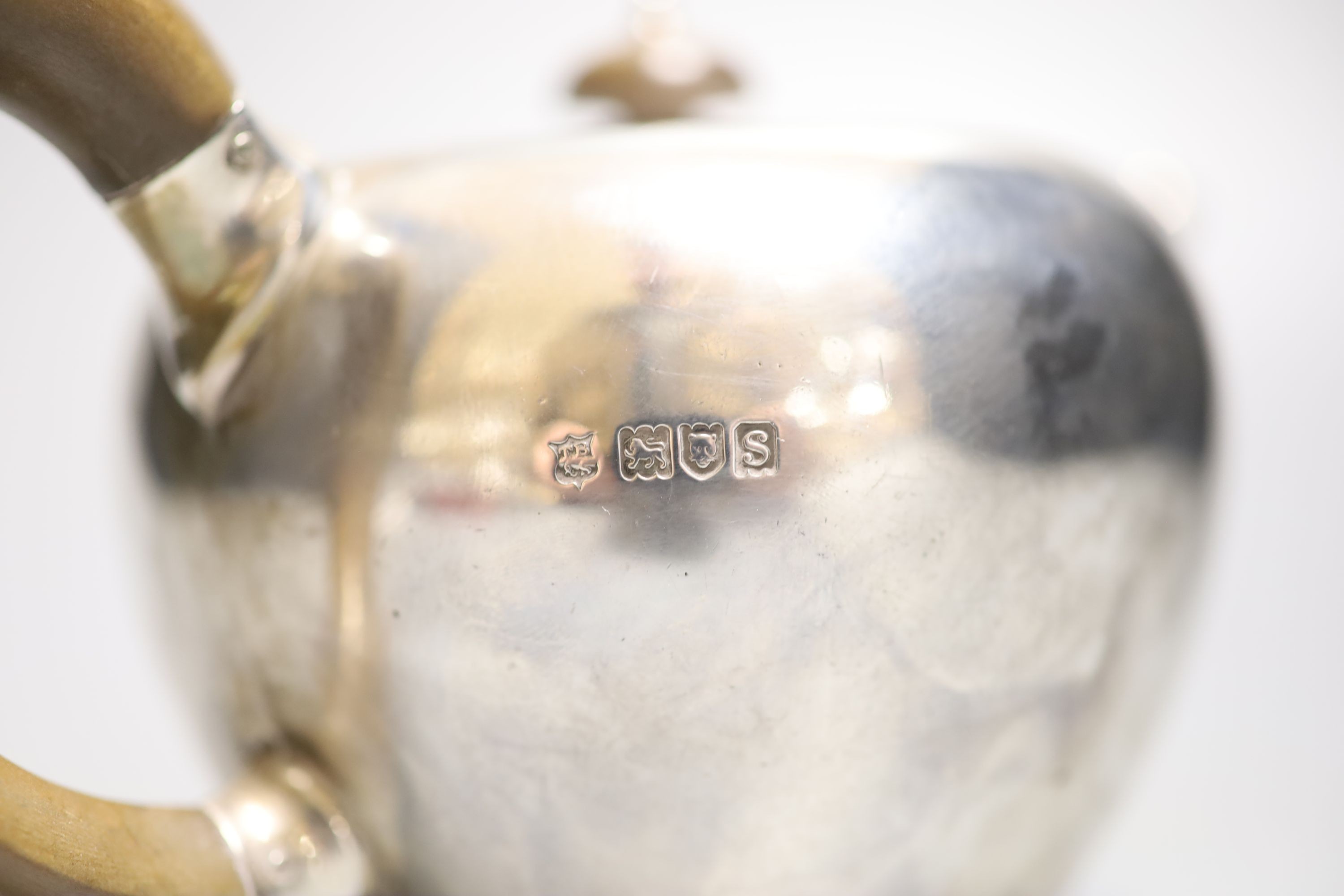 A George V silver bullet shaped teapot, Thomas Bradbury & Sons, London, 1913, gross 13.5oz.